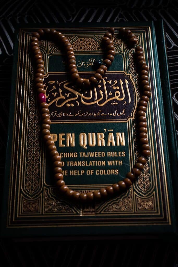 pexels photo 8407961 Intricate design of a Quran with prayer beads, symbolizing Islamic faith and spirituality.